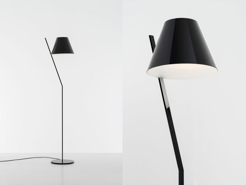 A sleek black floor lamp with a cone-shaped shade and a minimalist design on a neutral background.