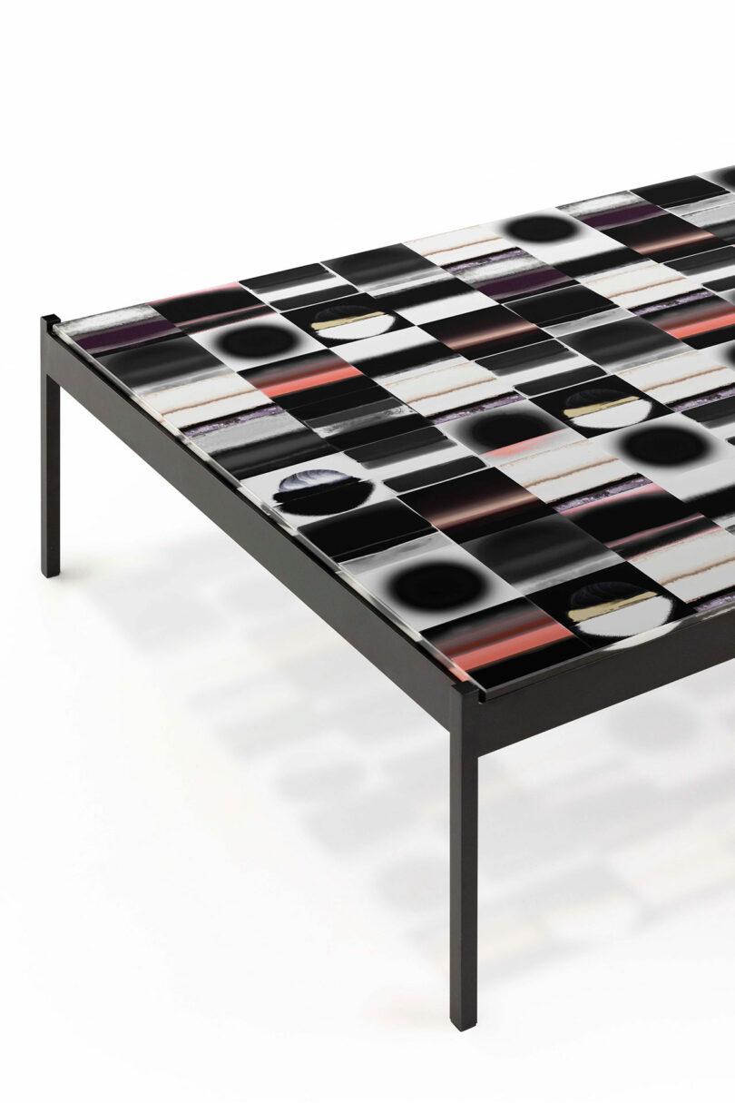 A modern bed frame with a checkered pattern featuring black, white, red, and dark circular designs on the surface.